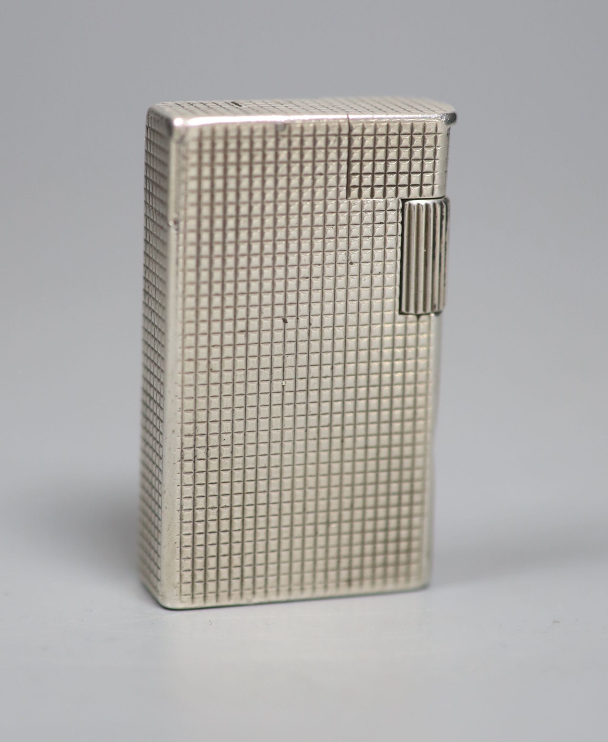 An early 1960s silver Dunhill lighter, 54mm.